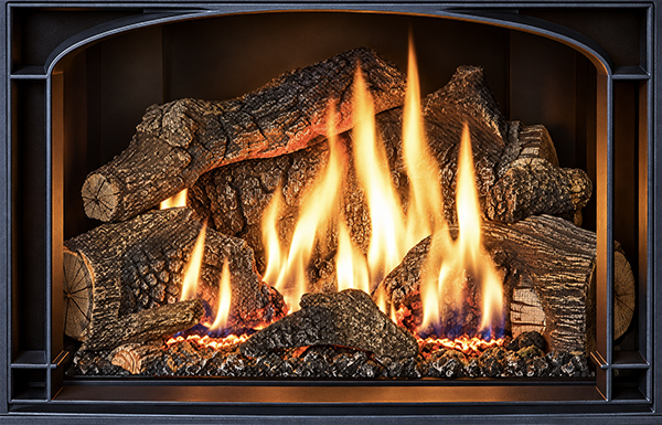 Wood-burning fireplace with stacked logs and bright orange flames creating a warm glow