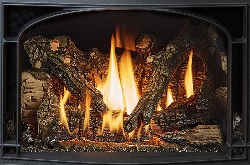 Wood-burning fireplace with glowing logs and tall flames in a black metal surround.